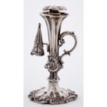 A Victorian silver taperstick, of flared shape with double scroll handle, conical extinguisher and