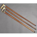 Three Malacca walking canes, late 19th / early 20th c, one with plated brass pommel, the others with