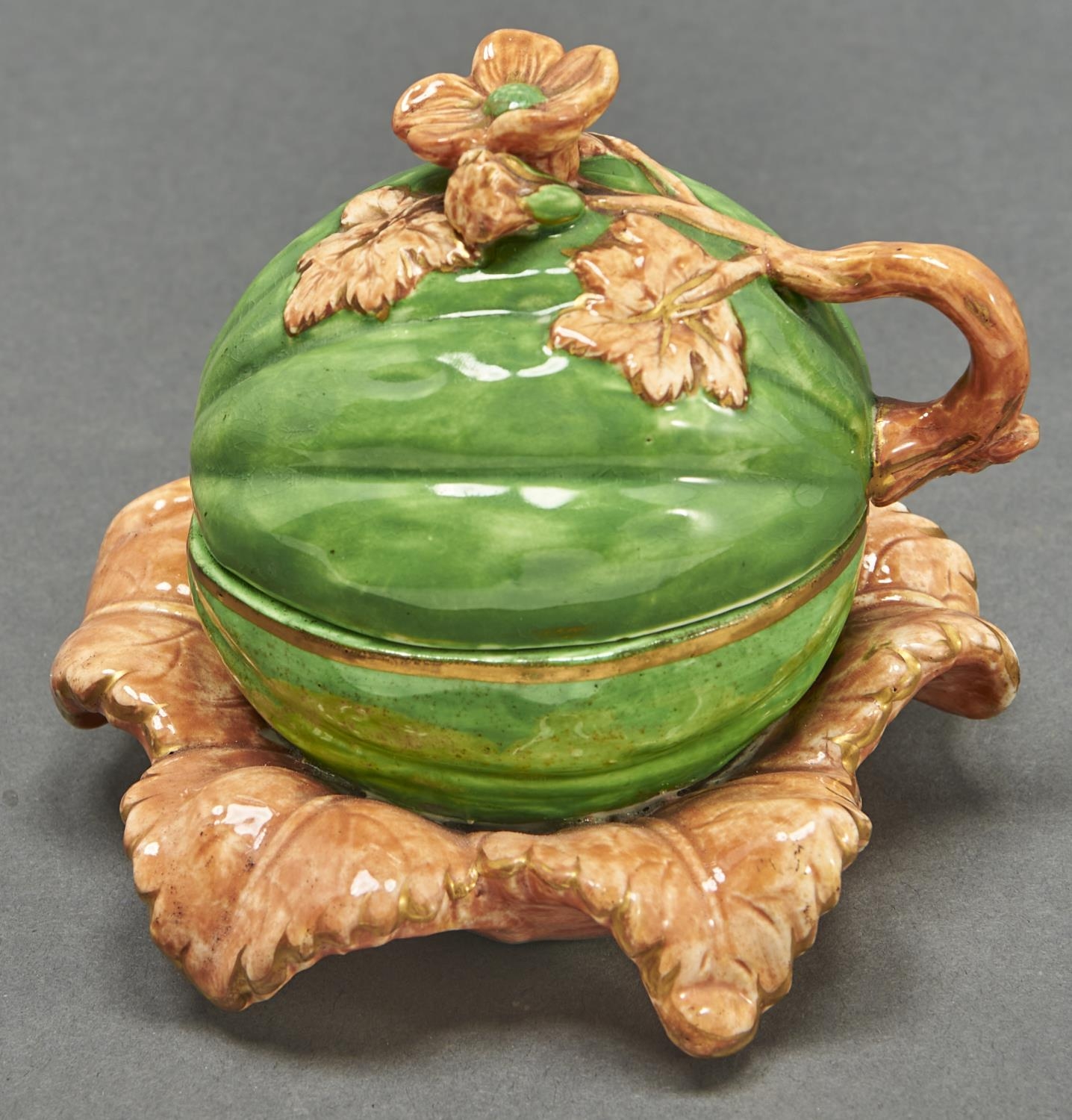 A Staffordshire bone china melon form inkwell and cover, c1840, realistically decorated in green and