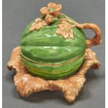 A Staffordshire bone china melon form inkwell and cover, c1840, realistically decorated in green and