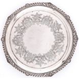 A Victorian gadrooned silver salver, the field engraved with a border of flowers and strapwork, on