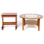 A Schreiber teak coffee table, c1970's, with inset glass centre, 44cm h x 85cm diam and a