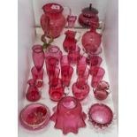 A quantity of Victorian and later cranberry glass, to include dimpled jug with clear reeded glass