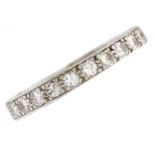 A diamond eternity ring, with round brilliant cut diamonds, in platinum coloured metal, 2.8g, size M