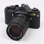 A Pentax ME Super SLR 35mm camera, with SMC Pentax-M 135mm F3.5 lens In apparently working order,