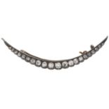 A Victorian diamond crescent brooch, with old cut diamonds, in silver and gold, 47mm, 2.9g Complete,