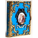 A French diamond and gold and enamel mounted book shaped double miniature frame, 19th c, with two