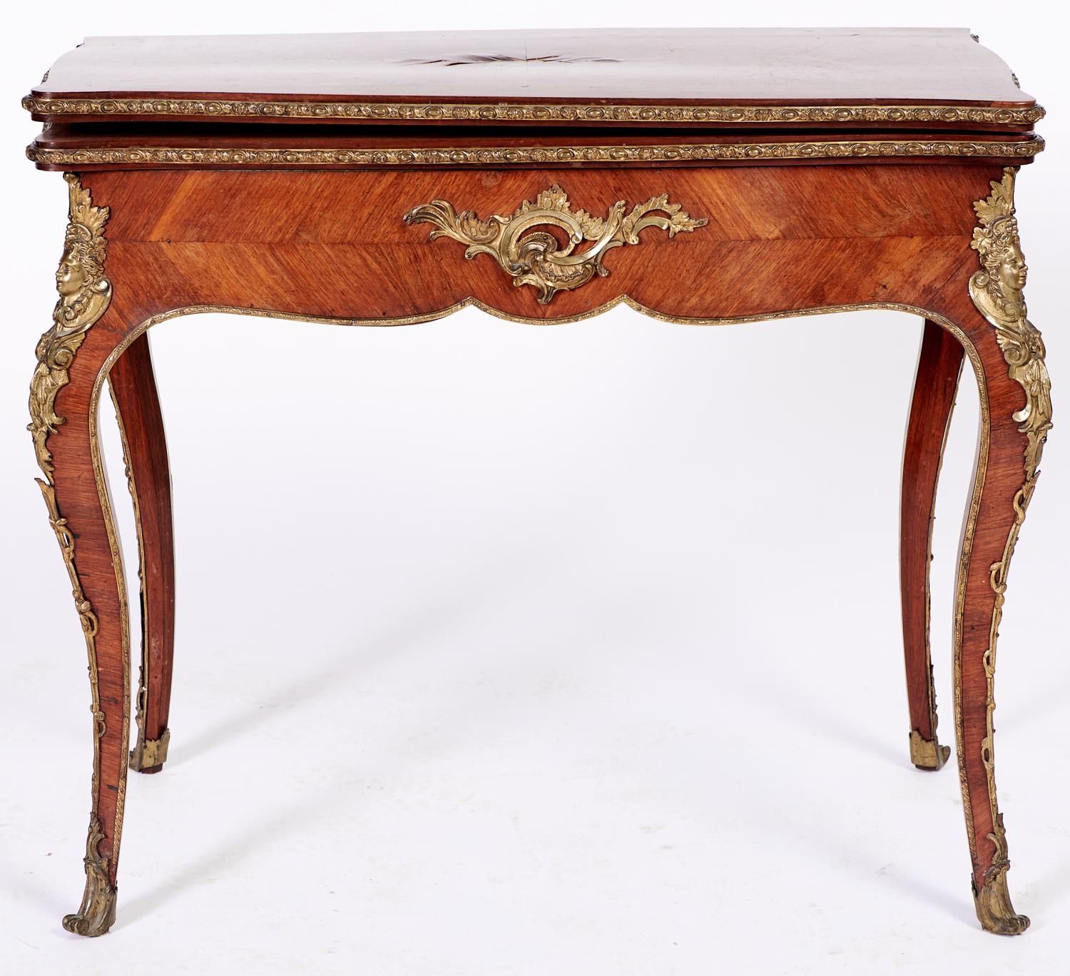 A French ormolu mounted kingwood card table, c1870, in Louis XV style, with quarter veneered top and