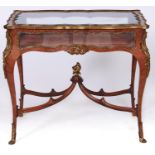 A French ormolu mounted kingwood display table, late 19th c, in Louis XV style, with bevelled