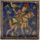 A Middle Eastern glazed tile, painted with a mounted falconer, 23.5 x 23.5cm Slightly chipped and