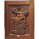 A carved oak bas relief panel, first half 20th c, of a bacchante and cupid, in oak frame, 75 x 58.