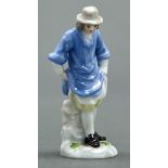 A Meissen miniature figure of a man in a lavender coloured smock, late 19th / early 20th c, 77mm