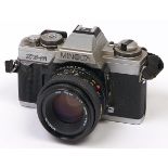 A Minolta XG-M SLR 35mm camera, with Minolta MD 50mm F1.7 lens In apparently working order, wear