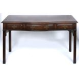 A Victorian serpentine mahogany serving table, late 19th c, in George III style, the top with