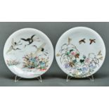 A pair of Japanese milk glass dishes, enamelled with birds and flowers, early 20th c, 18.5cm diam