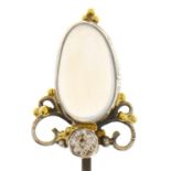 An Arts and Crafts stick pin with moonstone and diamond terminal, early 20th c, head 19mm, steel