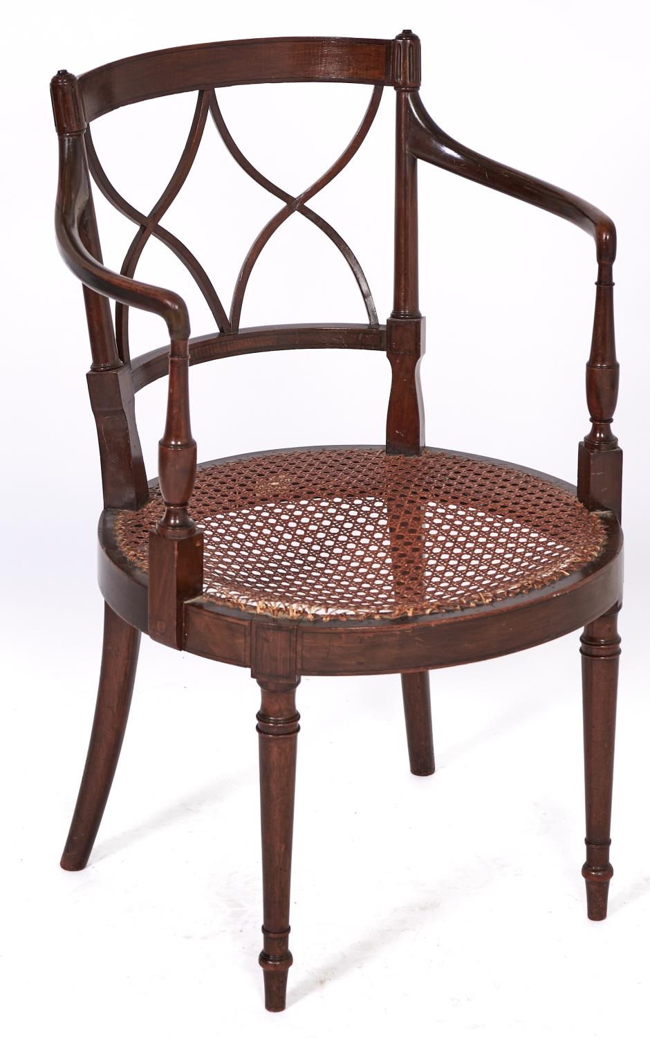 A mahogany and line inlaid elbow chair, early 20th c, in Regency style, with caned circular seat,