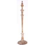 A limed pine floor lamp, crisply carved with overlapping acanthus leaves, 146cm h excluding