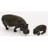 A pair of bronze animalier sculptures of an hippopotamus mother and baby, cast from models by J R
