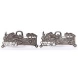 An unusual pair of Edwardian silver fishermen novelty menu or place stands, cast in the form of a