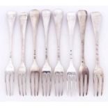 A set of four George I silver table forks, Hanoverian pattern, crested, marks rubbed, by Paul Hanet,