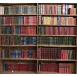 Twelve shelves of books, principally English literature in antique style bindings