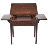 A George III mahogany draughtsman's table, c1790, the rectangular top with pair of folding