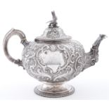 A Victorian silver teapot, of globular form, crisply chased with flowers and c-scrolls in beaded