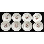 A set of eight Staffordshire bone china dessert plates, c1830, painted with a central flower spray