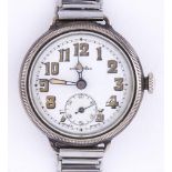 A silver wristwatch, M.D.S. guaranteed, with milled bezel and wire lugs