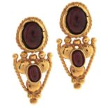A pair of cabochon garnet earrings, in gold marked 585, 4.7g