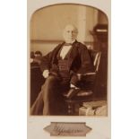 Autographs. Gladstone (William Ewart) - signed photograph of Gladstone seated at a desk, albumen