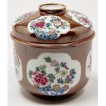 A Chinese famille rose cafe au lait ground bowl and cover, 19th c, decorated with peony, 18cm h