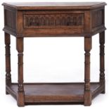 An oak side table, in 17th c style, of splay fronted design with nulled drawer, 51cm l