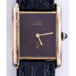 A Le Must de Cartier silver gilt wristwatch, with brown dial, mechanical movement, maker's box and