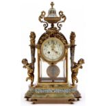 A French gilt brass, champleve enamel and onyx clock, c1900, the primrose enamel dial painted with