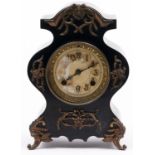 A brass mounted black painted cast iron mantel clock in rococo style, c1900, waisted case applied