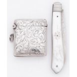 A George V silver vesta case, engraved with foliate scrolls, 38mm, by Henry Williamson Ltd,