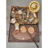 A carved oak tea tray with brass handles, a Victorian pierced brass footman, pewter and other