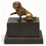 A French parcel gilt bronze encrier, c1840, the rectangular cover surmounted by a seated poodle, the