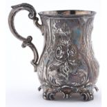 A Victorian silver christening mug, chased with strapwork and flowers, on four feet, 10cm h,