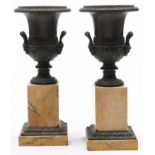 A pair of French bronze vases, 19th c, of campana shape, on bronze mounted sienna marble base,