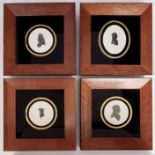 A set of four bird's eye maple and ebonised picture frames, each with verre eglomise mount and print