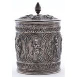 An Indian silver repousse cylindrical tea caddy and cover, Madras, c1890, worked with a swami band