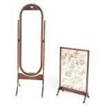 A mahogany cheval mirror, 20th c, 50cm h and an oak firescreen with embroidered banner