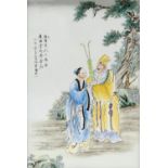 A Chinese porcelain plaque, polychrome decorated with elderly bearded figure and courtesan holding a