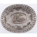A German silver pierced oval fruit dish, stamped with shepherds in festoon and trellis border,