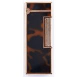 An Alfred Dunhill gold plated and faux tortoiseshell rollagas cigarette lighter, boxed, maker's