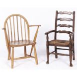 An Ercol child's armchair, with a child's rush seated ash ladder back armchair