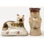 A Staffordshire earthenware model of a tabby cat, c1860-90, 70mm h and a miniature saltglazed
